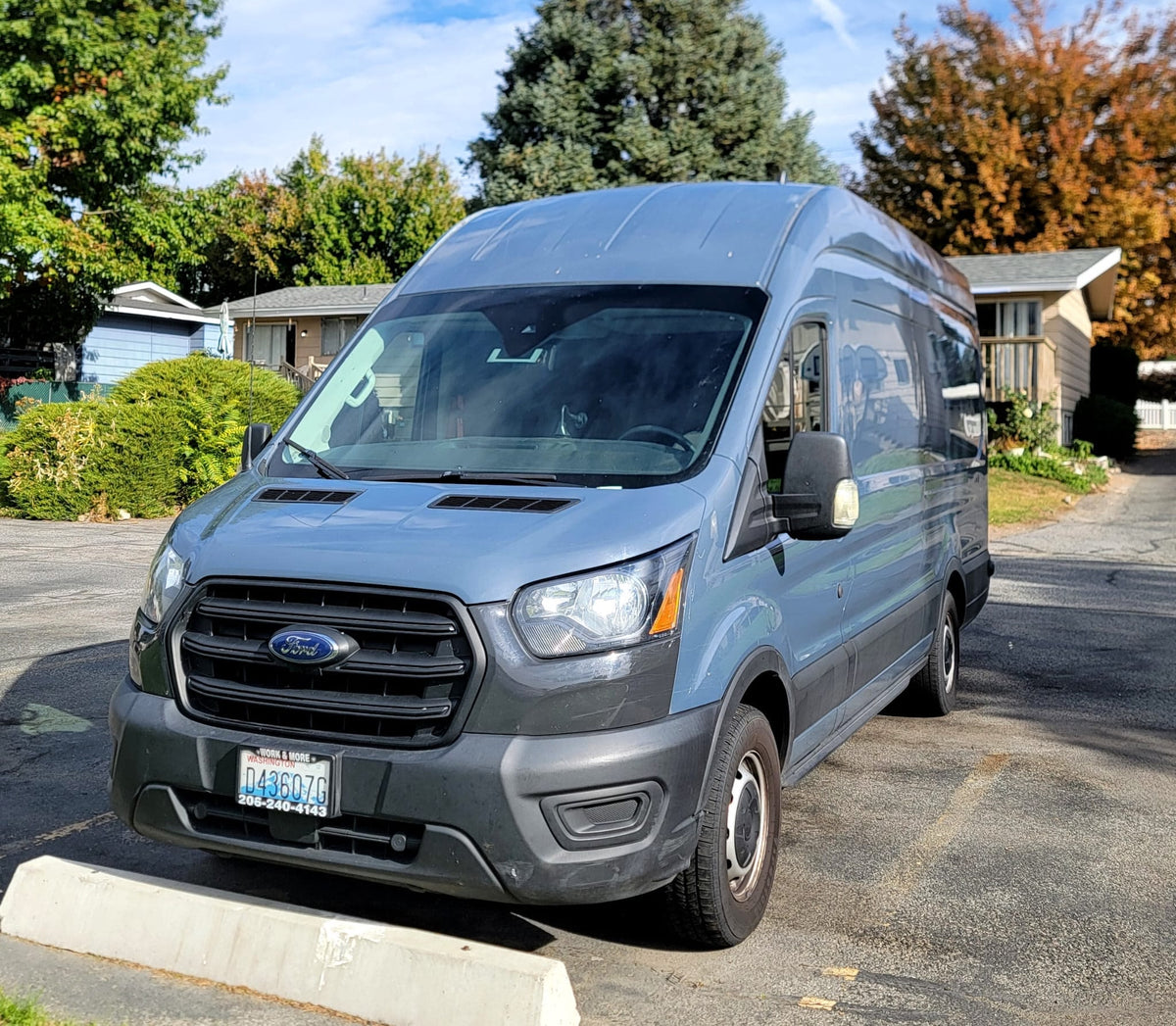 A blue Ford Transit van (Work & More rental) — photo 1