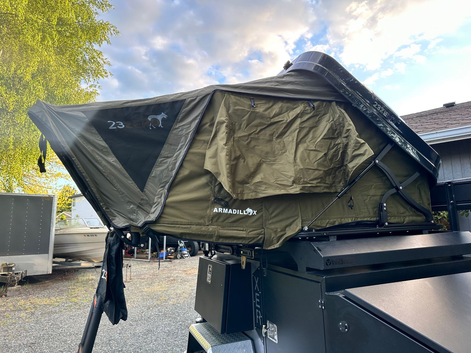 a complete setup for an rv rental adventure.|Modified grey Jeep Gladiator towing an off-road camping trailer