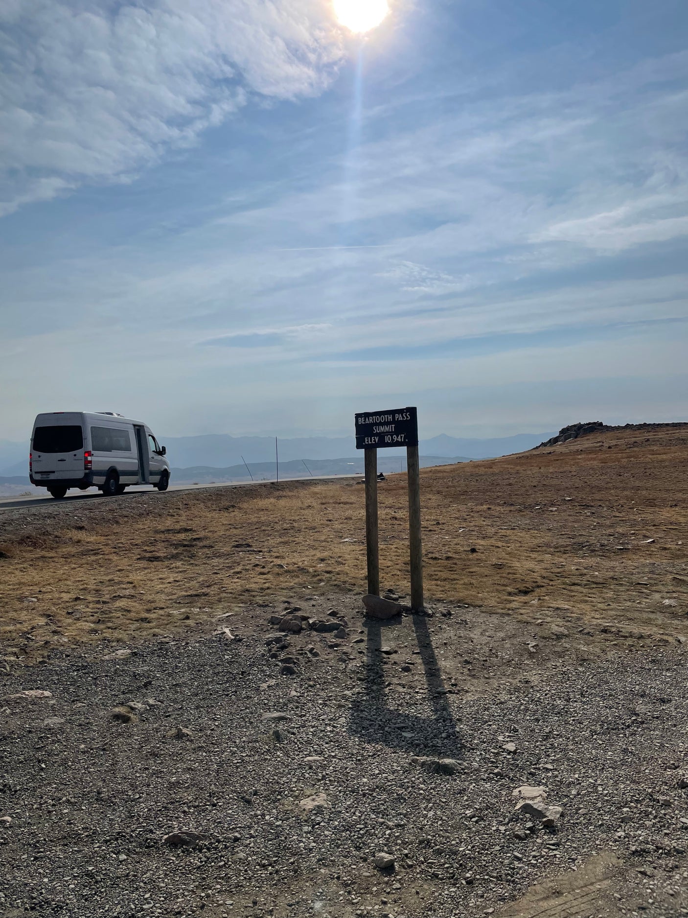 RV rental at Beartooth Pass Summit, elevation 10,947 feet, with scenic mountain views.