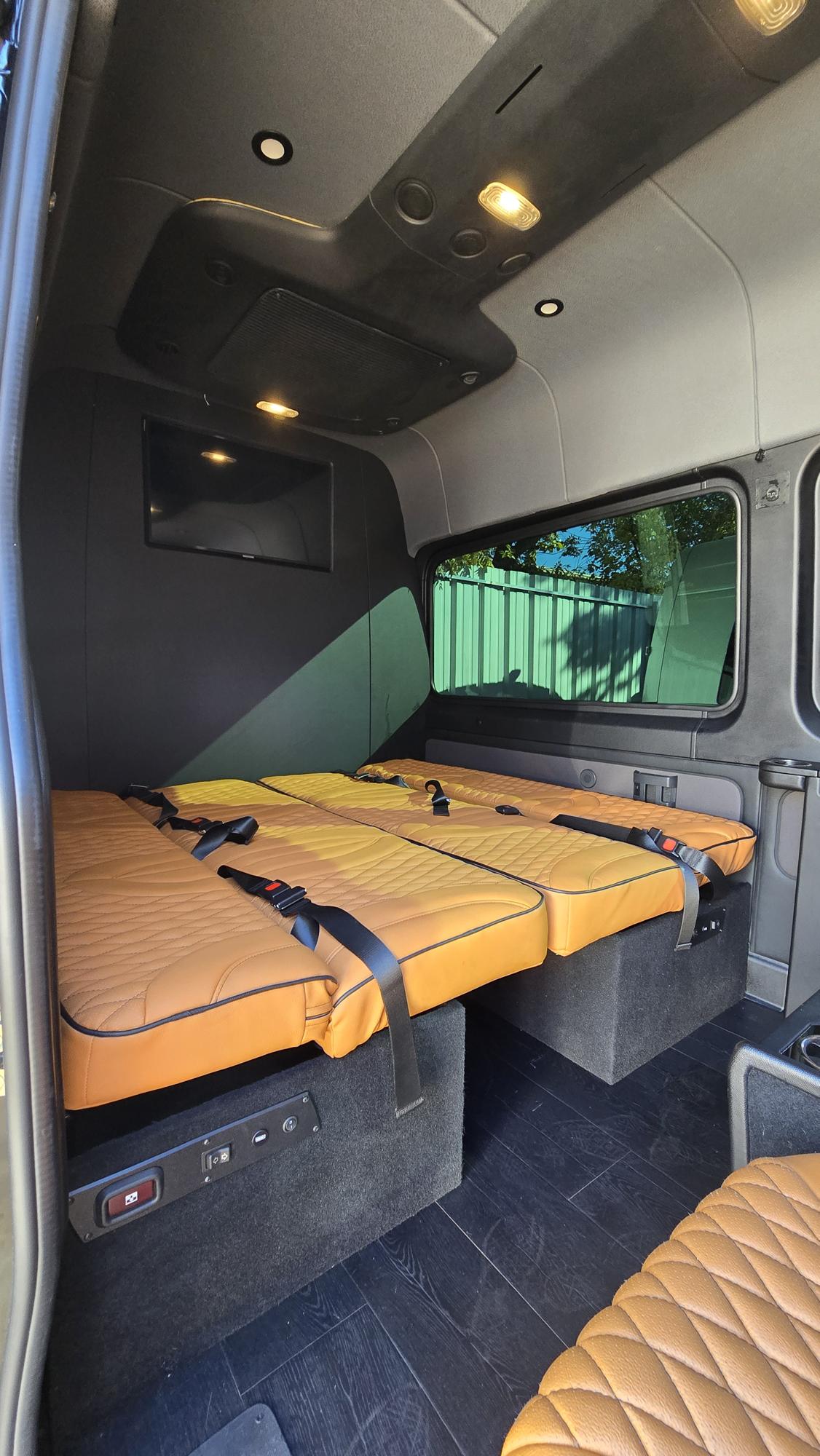 and console offer premium comfort for travel.|Luxury RV rental interior with plush Mercedes-Benz leather seats — photo 6