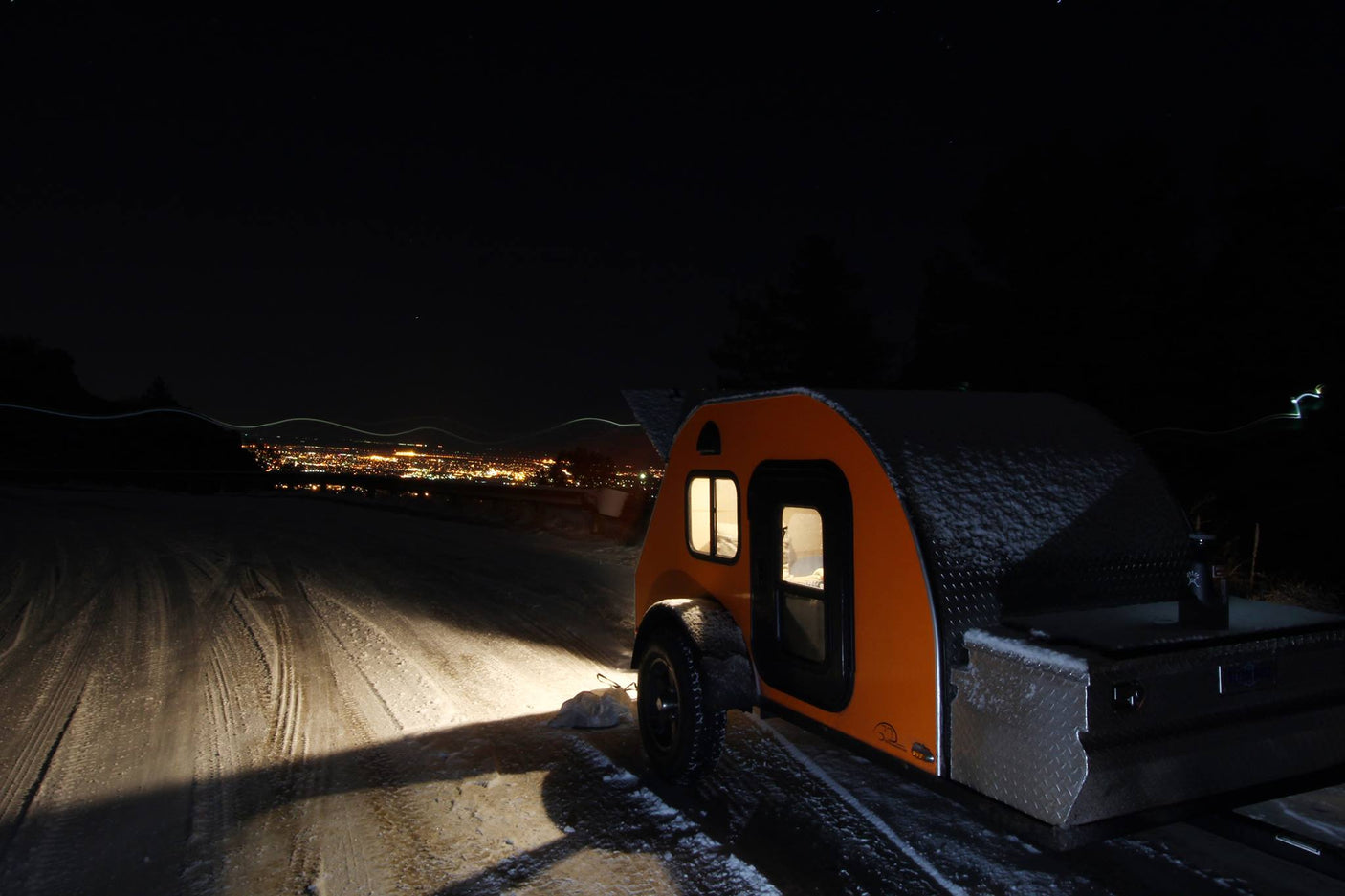 perfect for outdoor adventure.|Cozy teardrop RV rental parked on a snowy mountain