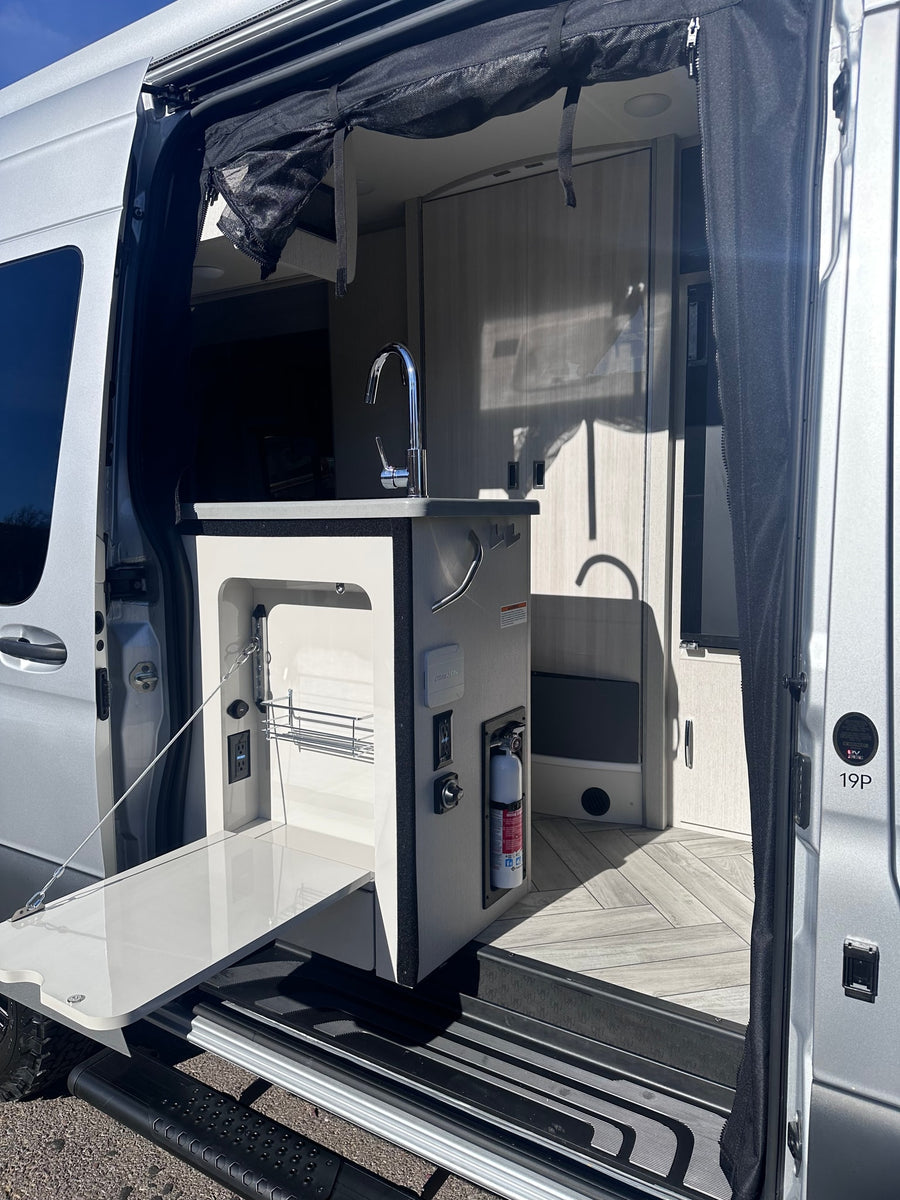 ideal for an rv rental adventure.|RV rental: Driver's side of a Mercedes-Benz Sprinter van with door open
