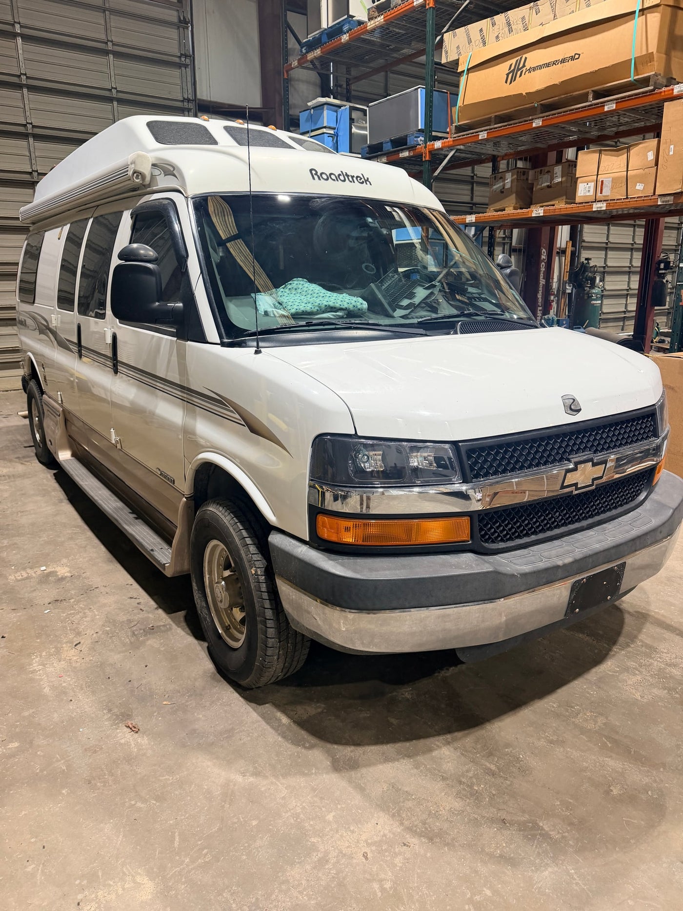 ready for your next road trip adventure.|A white and beige Roadtrek 190 Popular camper van — photo 2