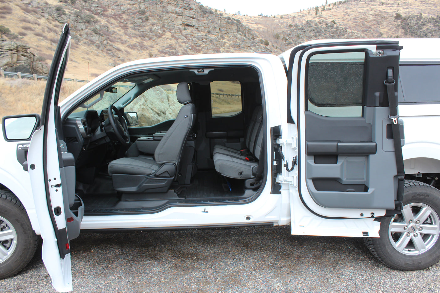 Spacious Ford F-150 pickup interior with open doors, showing ample seating for your next rv rental excursion.