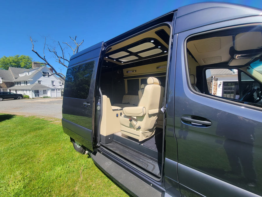 and ample space for executive travel.|Experience comfort in this luxury **rv rental** featuring plush white seats