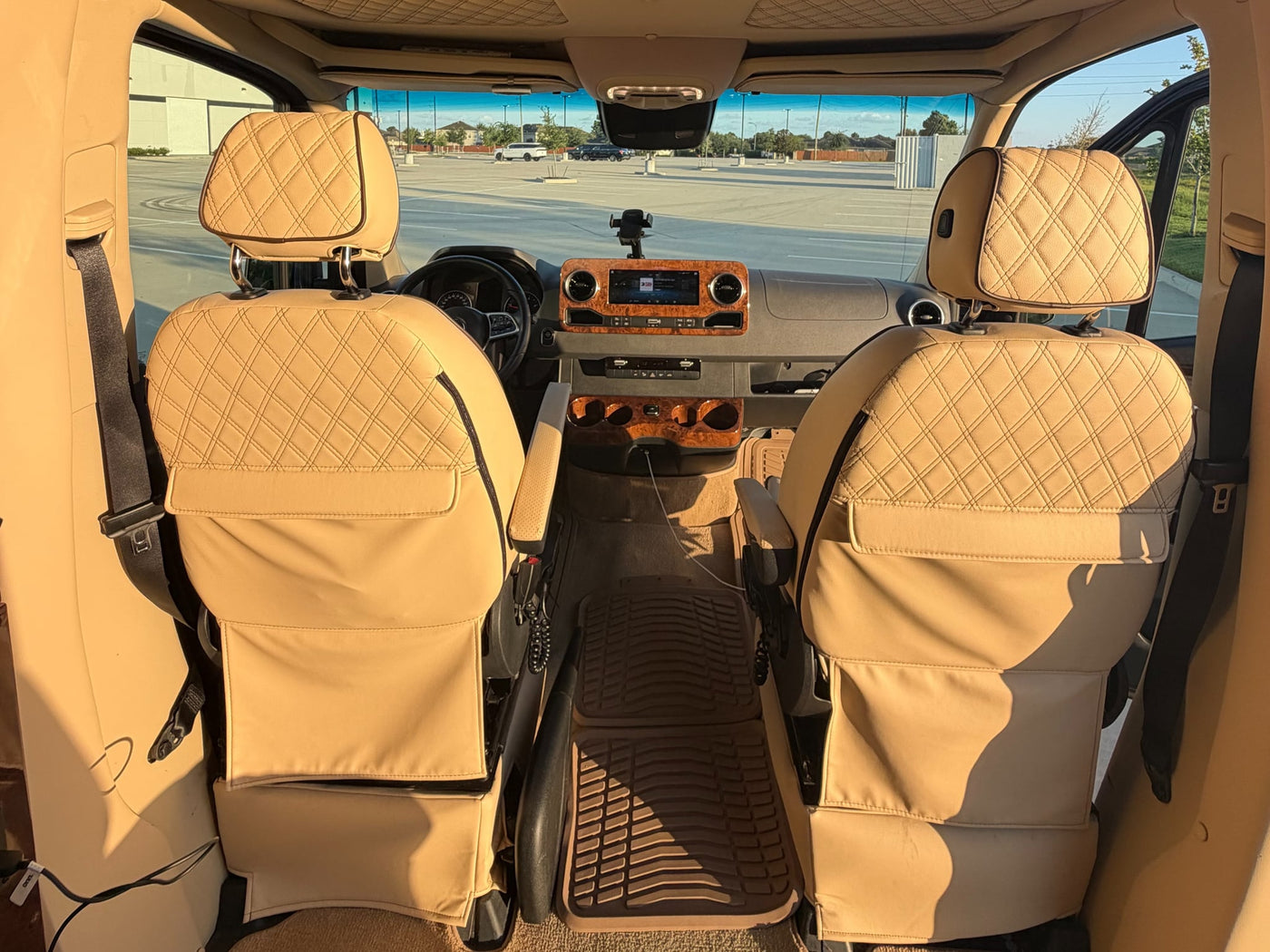 beige interior. Ready for premium travel and comfort.|Sleek black Mercedes-Benz Sprinter luxury van — photo 4