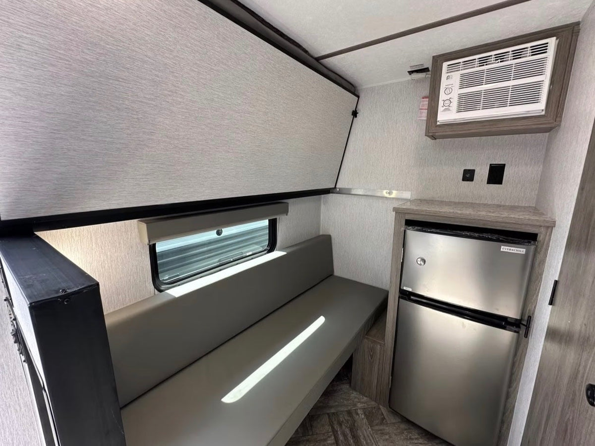 and awning. Ready for your next adventure!|RV rental interior: cozy bedroom with a new mattress — photo 6