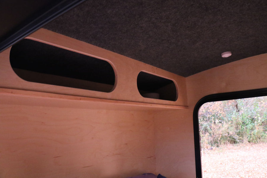 two overhead storage cubbies