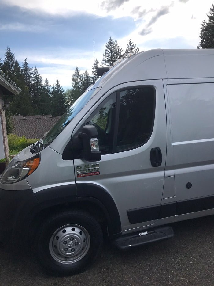 Side view of a high-roof silver Ram ProMaster 2500 van, a spacious option for rv rental.