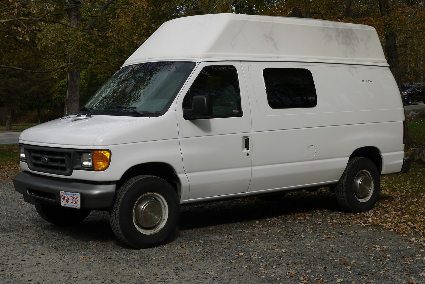 White Ford Econoline high-top camper van