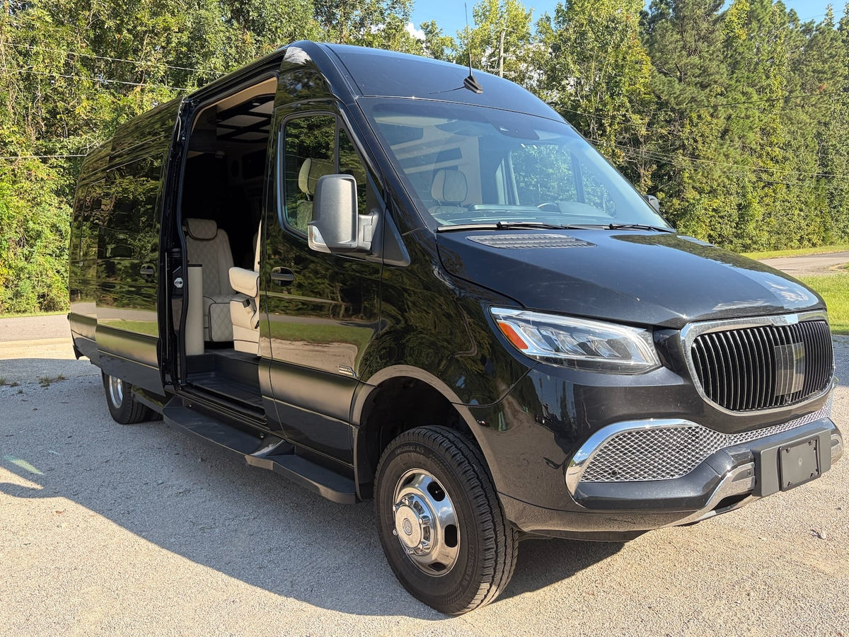 Experience comfort: Black Mercedes-Benz Sprinter van with open door revealing custom interior