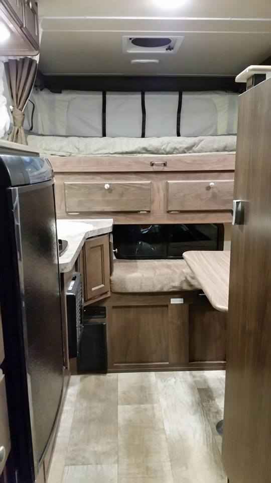 and a window view of lush nature.|RV rental comfort: A bright