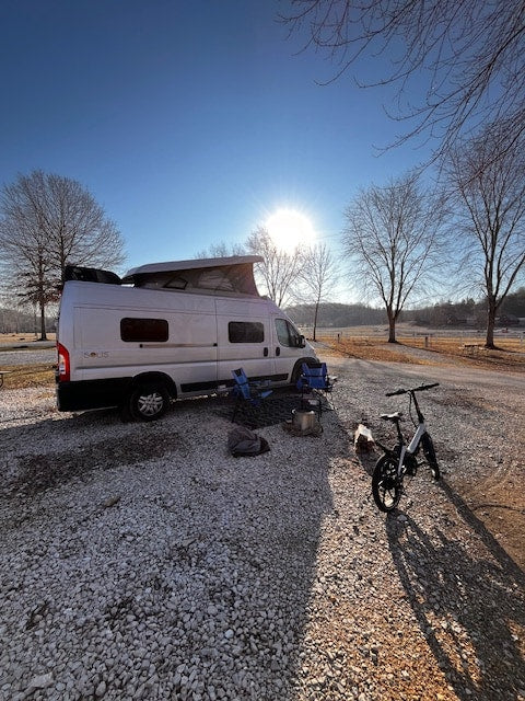 RV rental Winnebago Solis camper van at a gravel campsite