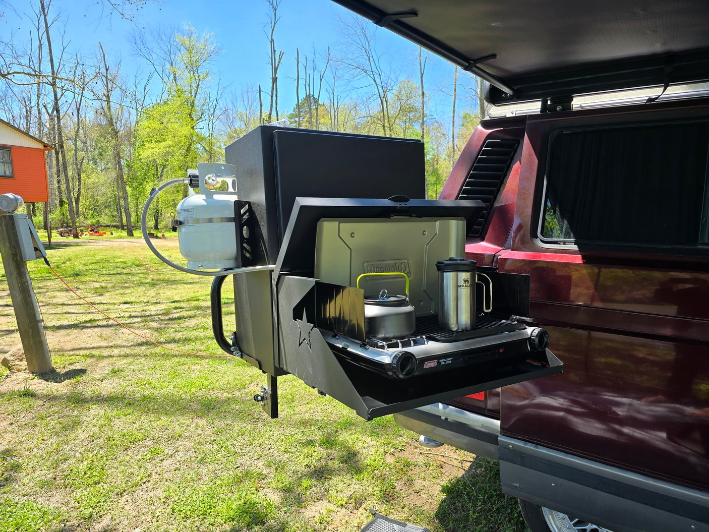 and overhead bed.|Inside a spacious RV rental camper van with a full kitchen