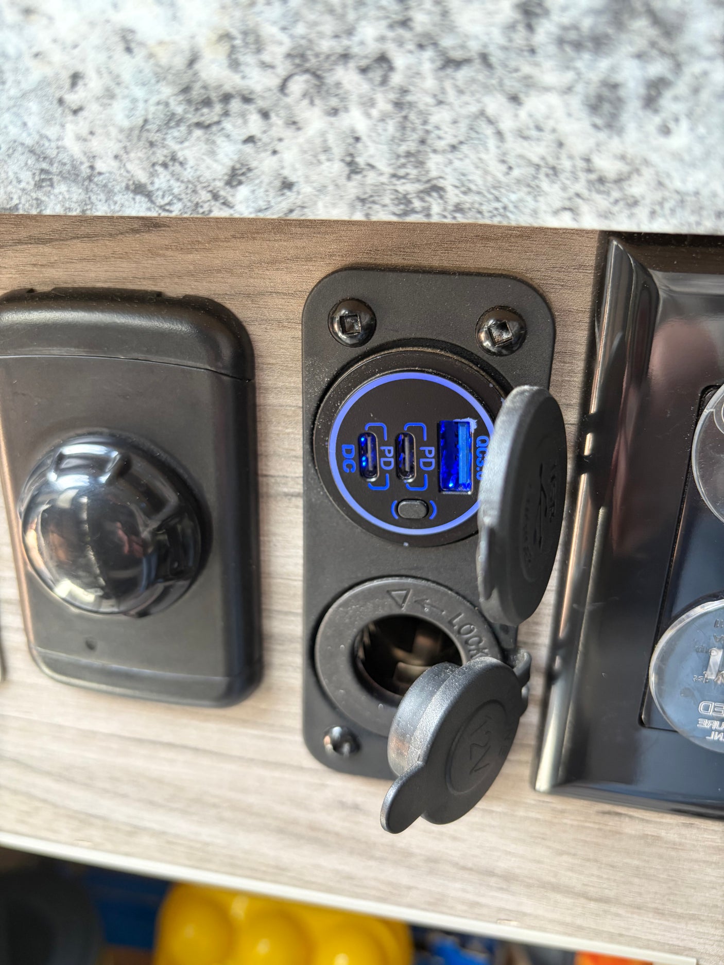 RV rental's convenient charging station: dual USB-C PD, USB-A QC3.0, and 12V socket, ready to power your devices.