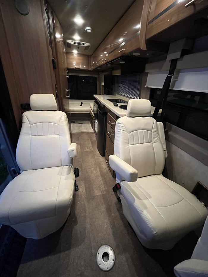 ideal for your next rv rental adventure.|This RV rental compact bathroom features a white interior with a toilet