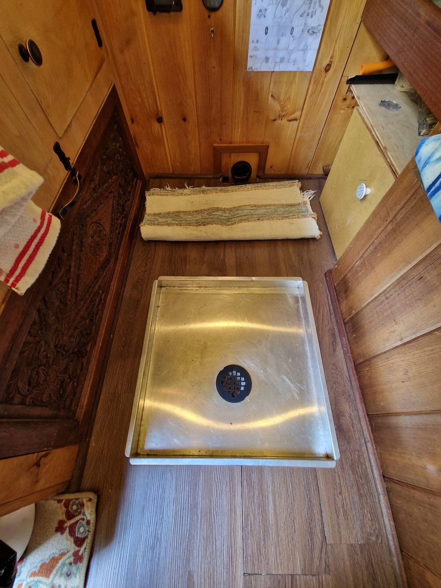 and outdoor view of a sunny green yard. Ideal for travel & adventures.|Inside an RV rental: A compact kitchen area featuring a two-burner stove