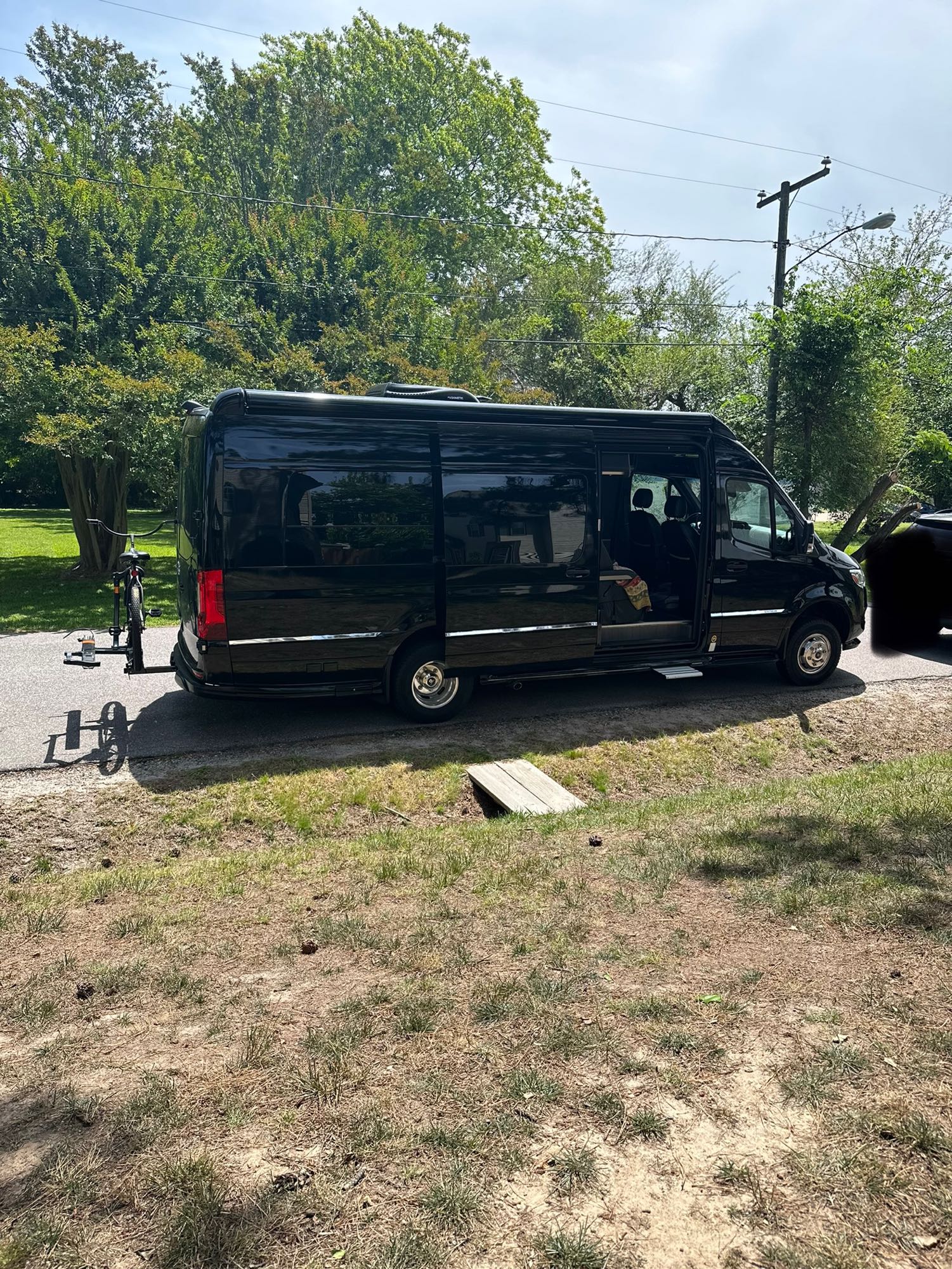 and comfortable leather seating.|Spacious RV rental interior with black leather seating