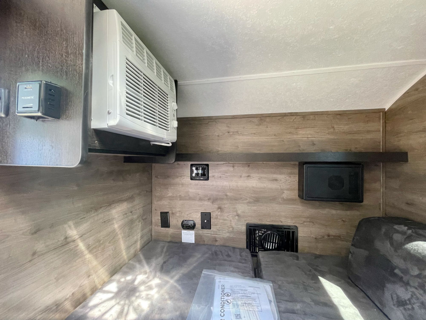 parked on gravel for outdoor travel.|This rv rental's outdoor kitchen is perfect for camping! Features a K2 cooler