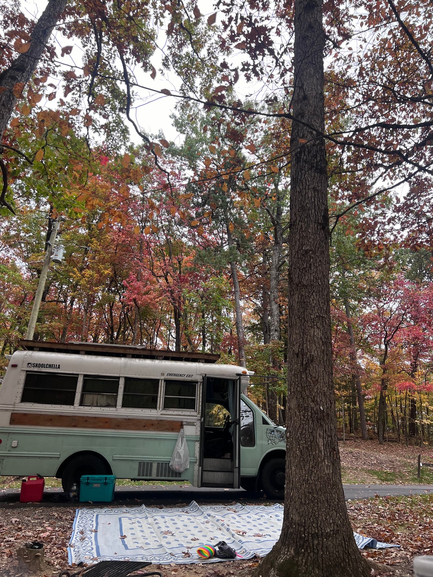 and a comfortable bed setup.|Cozy RV rental interior with kitchenette