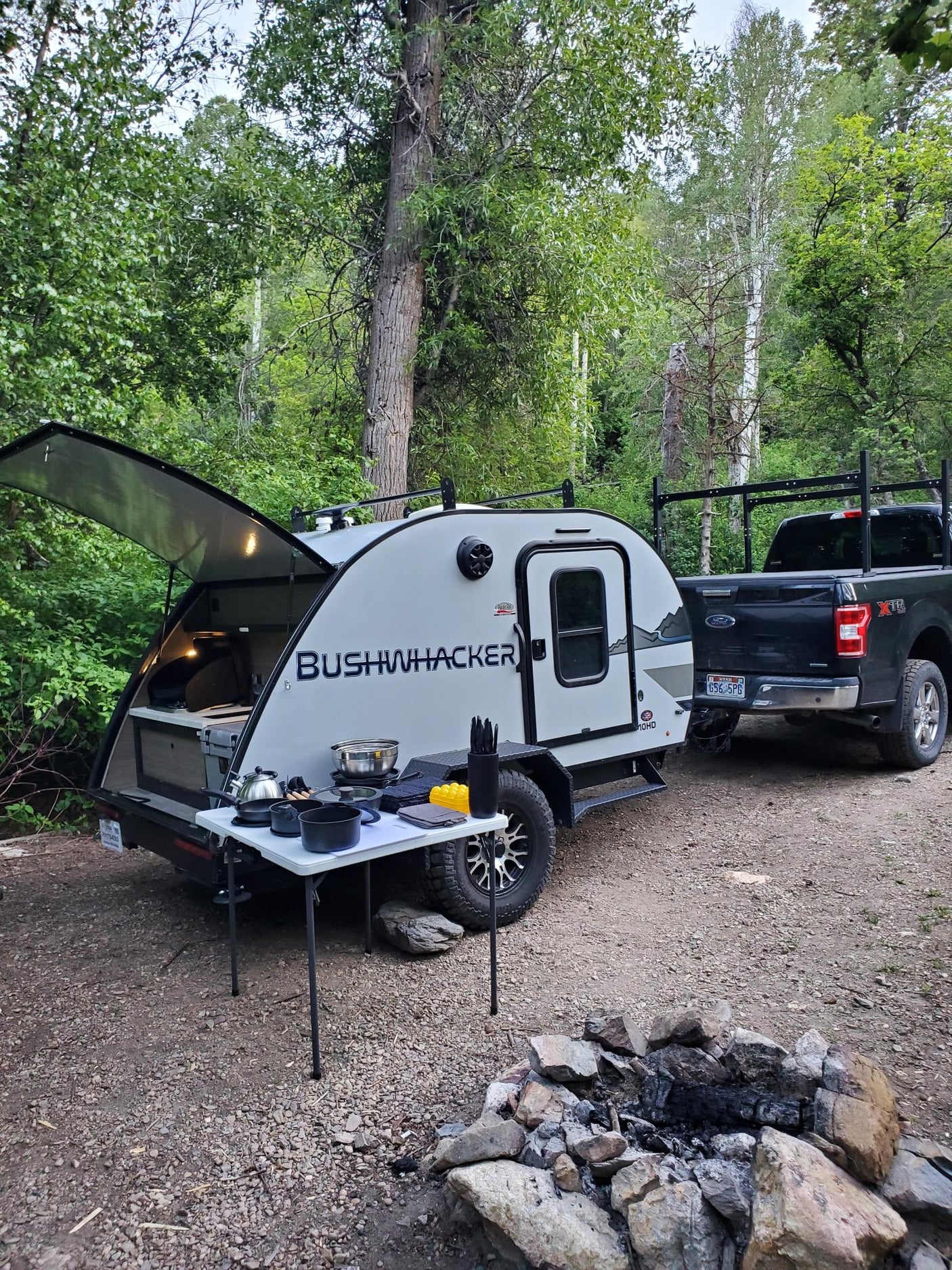 a rugged travel trailer on gravel
