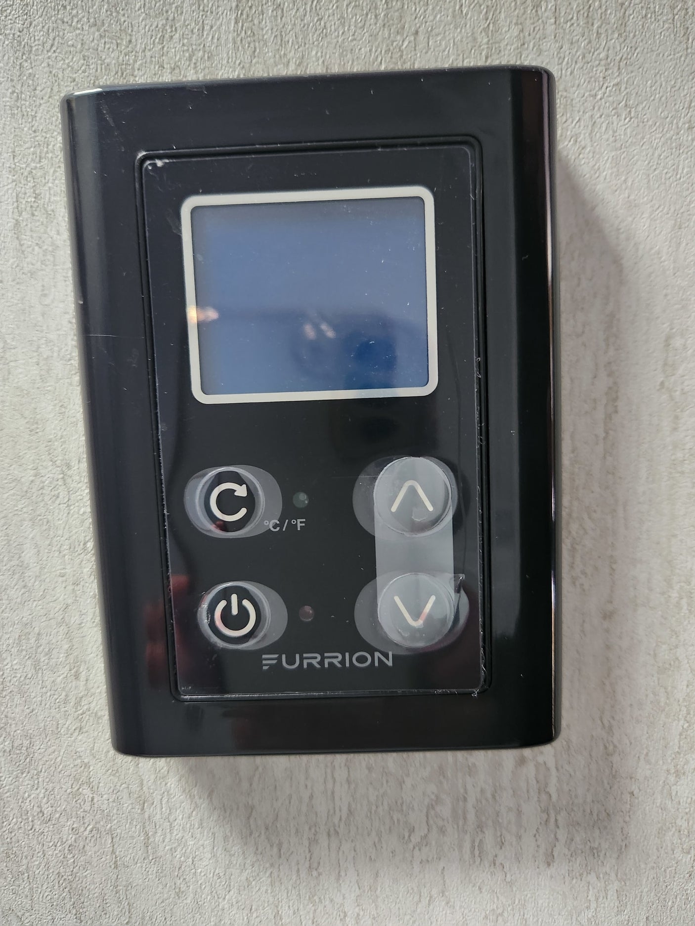 and fresh/city water connections on its side.|RV rental's front hitch with dual propane tank cover (Flame King) and trailer jack for safe towing.|Experience comfort in this RV rental bedroom