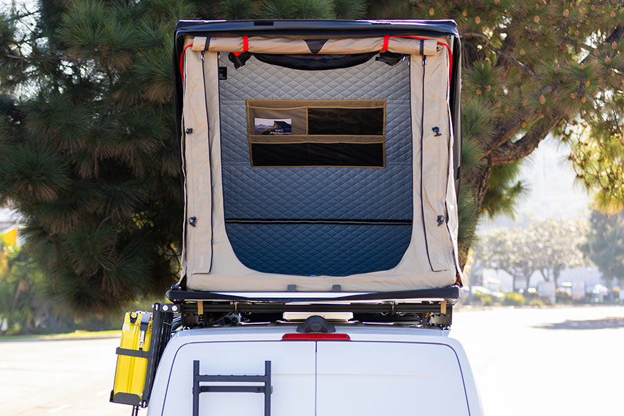 Rear view of an RV rental camper van with an open rooftop tent. Ready for your camping adventure.