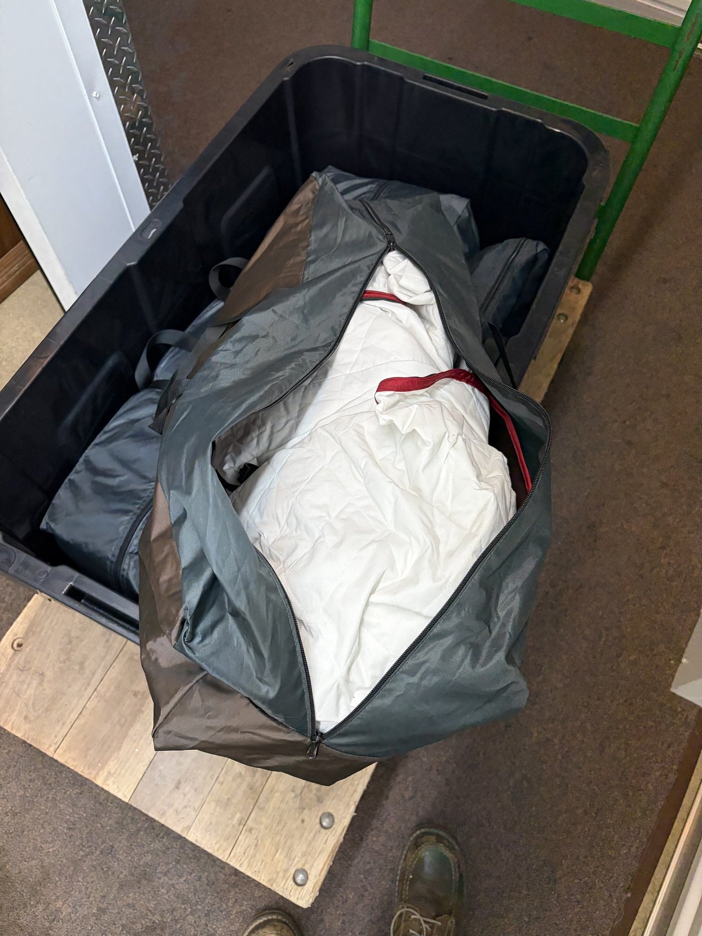 An open iKamper storage duffel in a tote showing the white quilted interior insulation packed inside — photo 12