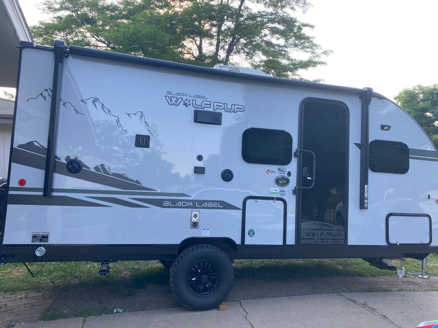 This gray Wolf Pup travel trailer is ready for adventure! Ideal for an RV rental to explore the outdoors.