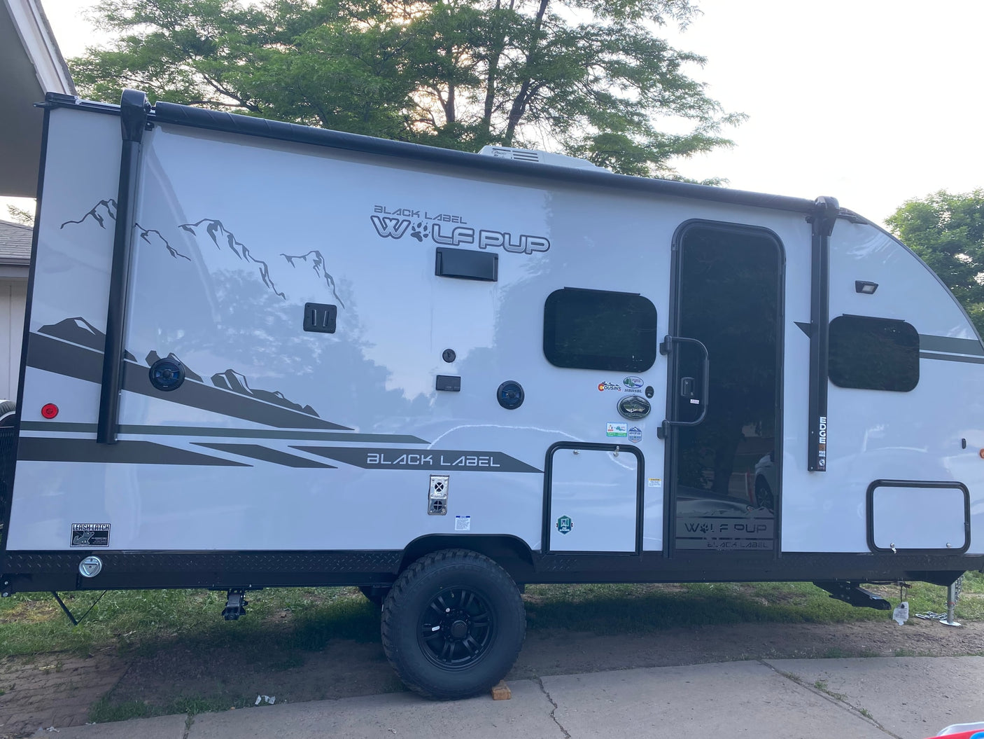 This gray Wolf Pup travel trailer is ready for adventure! Ideal for an RV rental to explore the outdoors.
