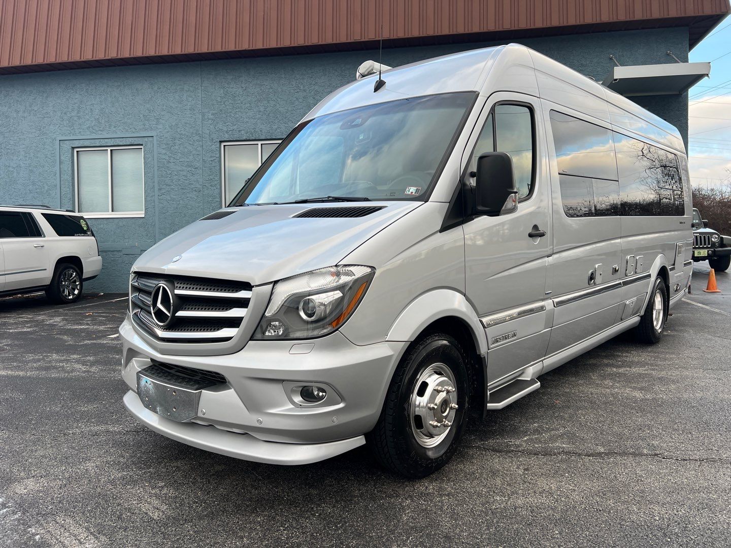 parked outside.|RV rental van with open rear doors