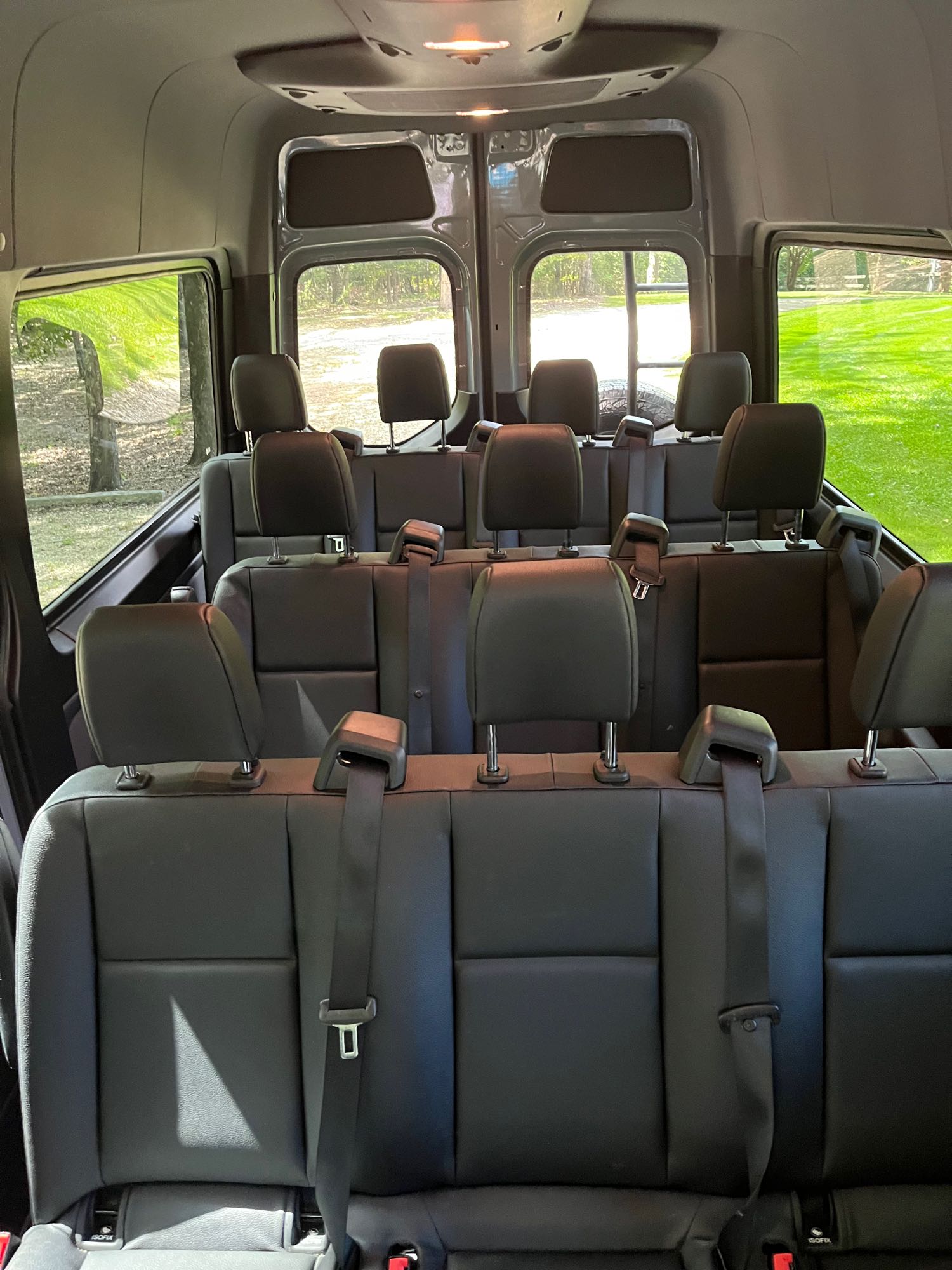 featuring a rear ladder and spare tire.|Grey Mercedes Sprinter camper van