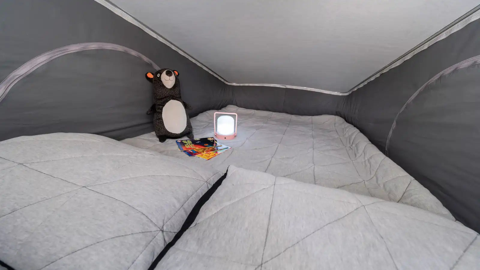 plus comfortable light-colored passenger seats.||Inside this RV rental: a compact kitchen on the left