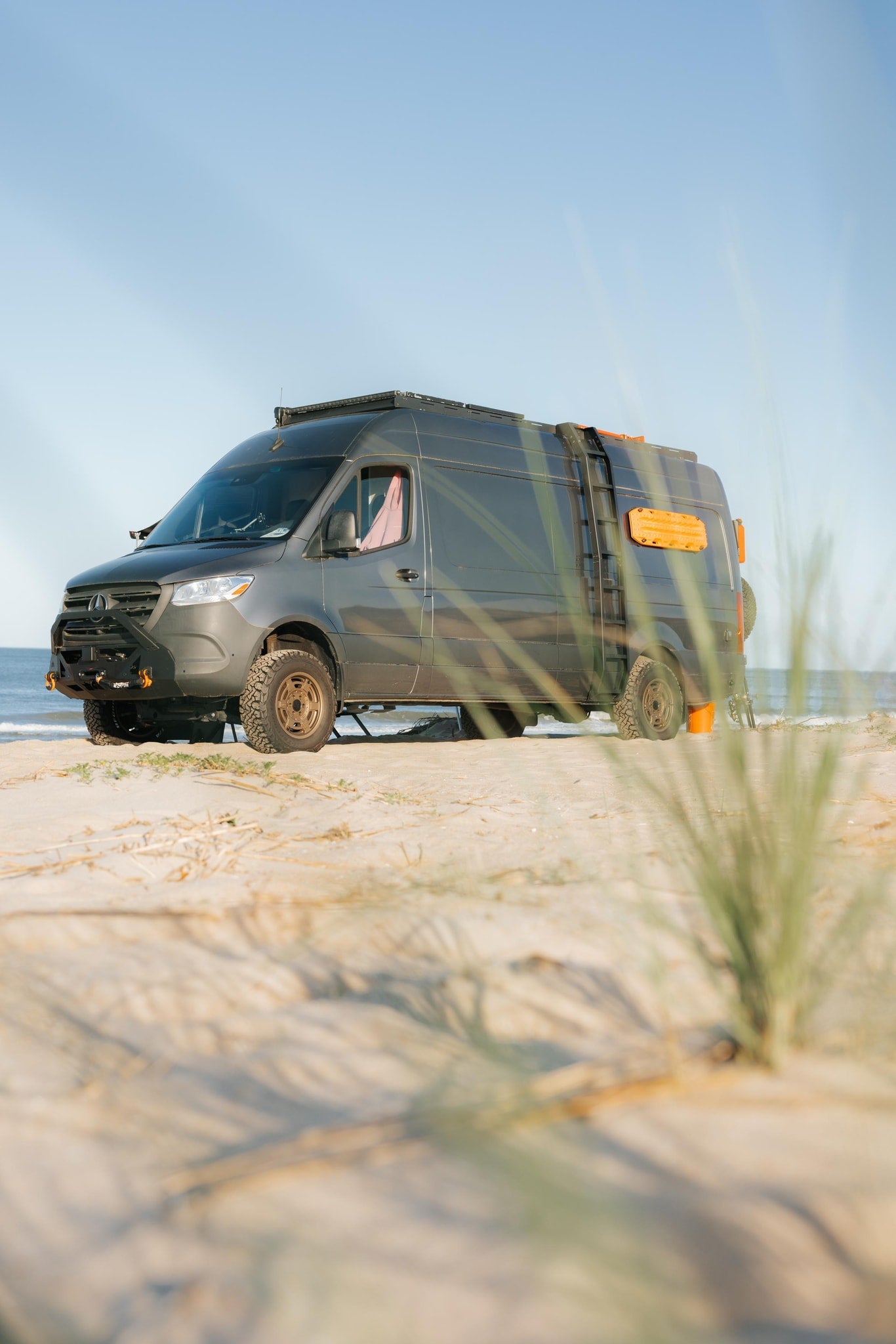 ready for adventure.|RV rental camper van on sand dunes with awning