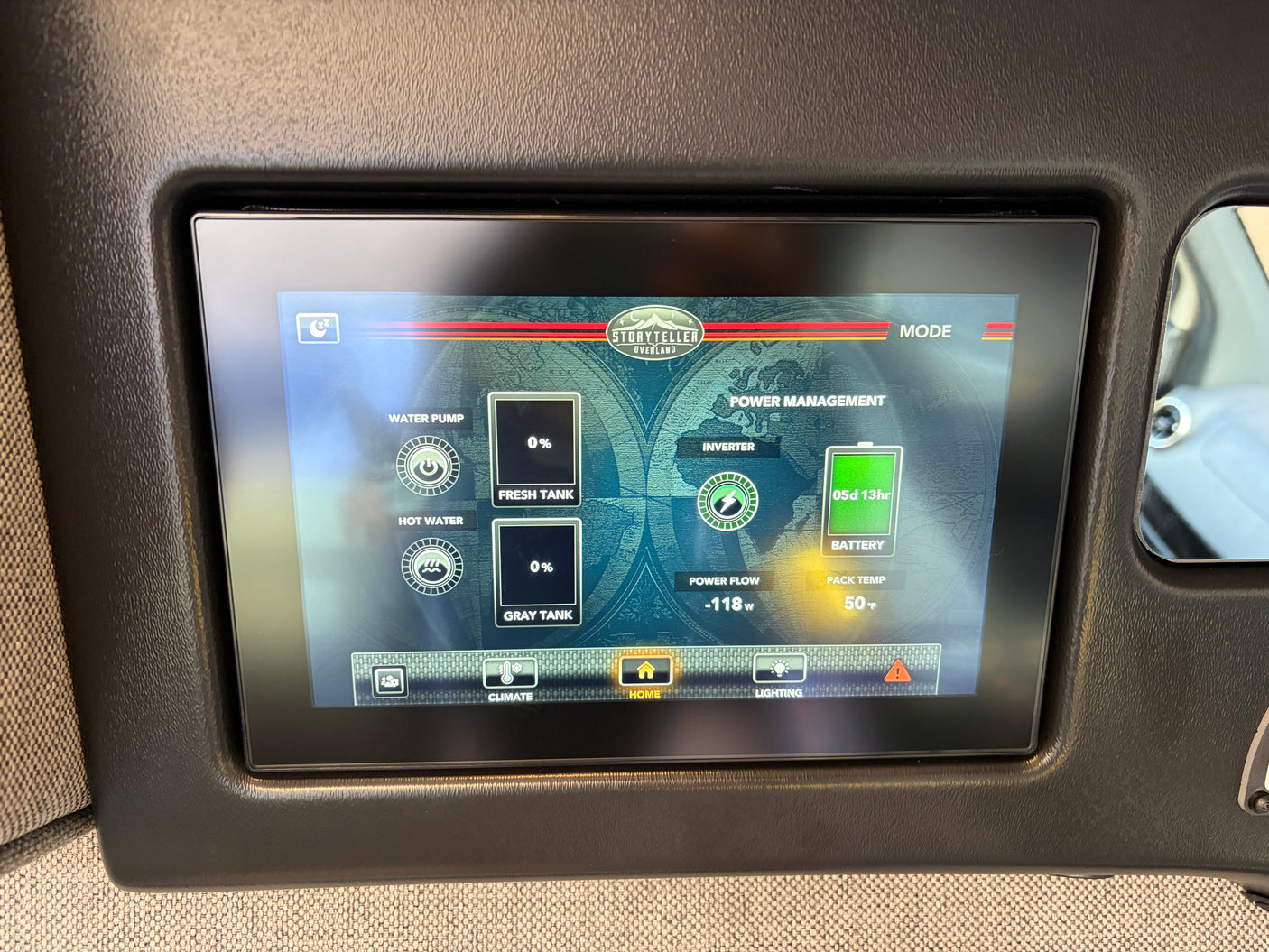An RV rental control panel shows Storyteller Overland power management: 5d 13hr battery life, -118W power flow, and 0% tank levels.