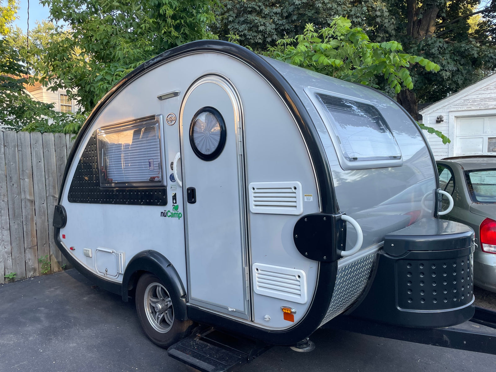 and TV.|Inside this RV rental: A compact kitchen with stainless steel sink