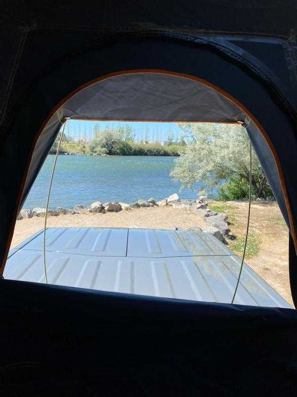 ready for outdoor adventure and camping.|Alternative RV rental: Pickup truck with an open Roofnest rooftop tent