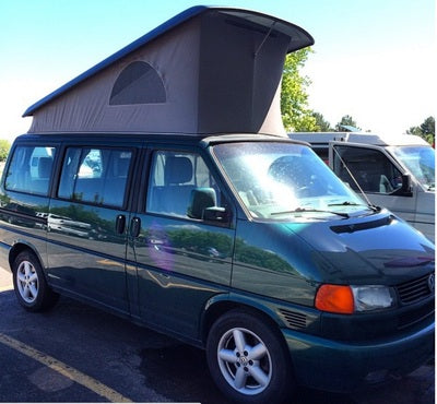 A dark green VW pop-top camper van with its roof raised, ideal for your next rv rental adventure.