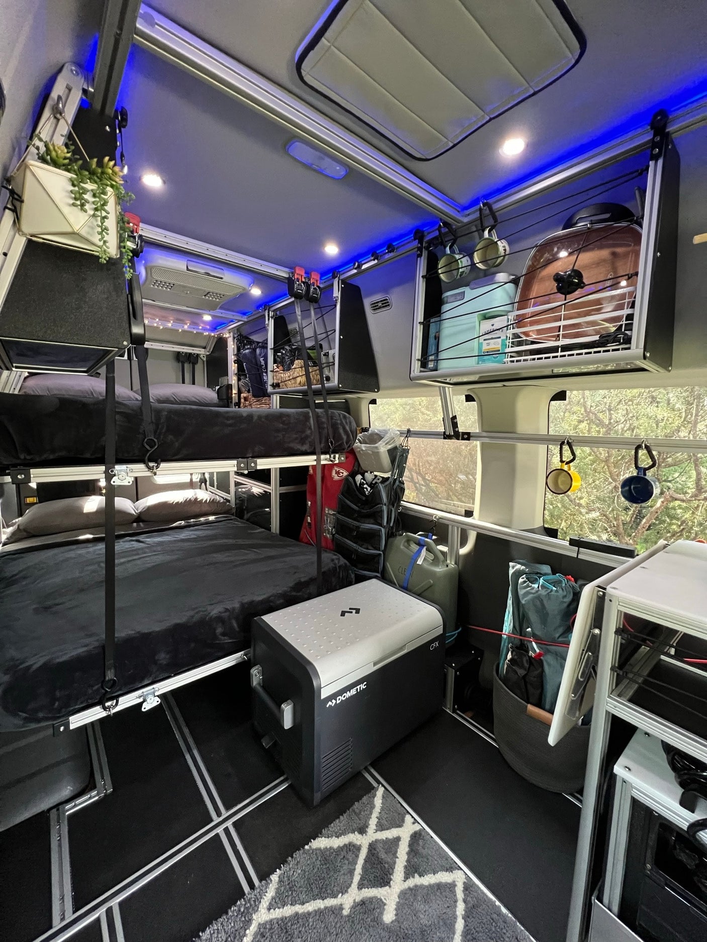 & custom kitchenette. Ready for your next rv rental road trip!|RV rental interior with bunk beds