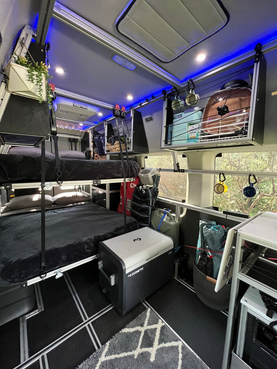 & custom kitchenette. Ready for your next rv rental road trip!|RV rental interior with bunk beds