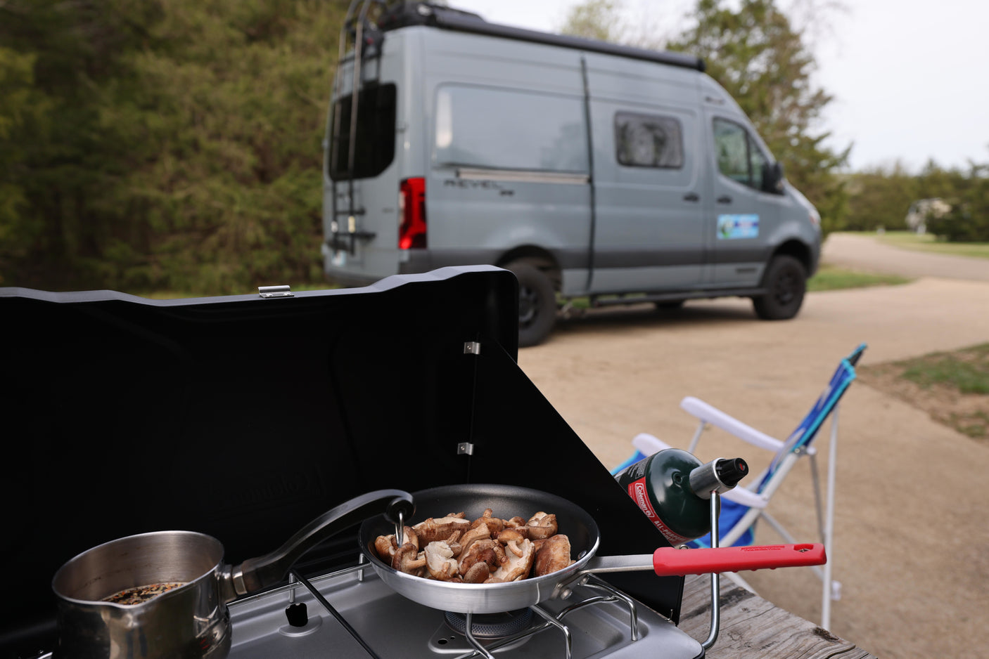 Outdoor cooking by an RV rental: mushrooms sizzling, coffee brewing, ready for adventure.