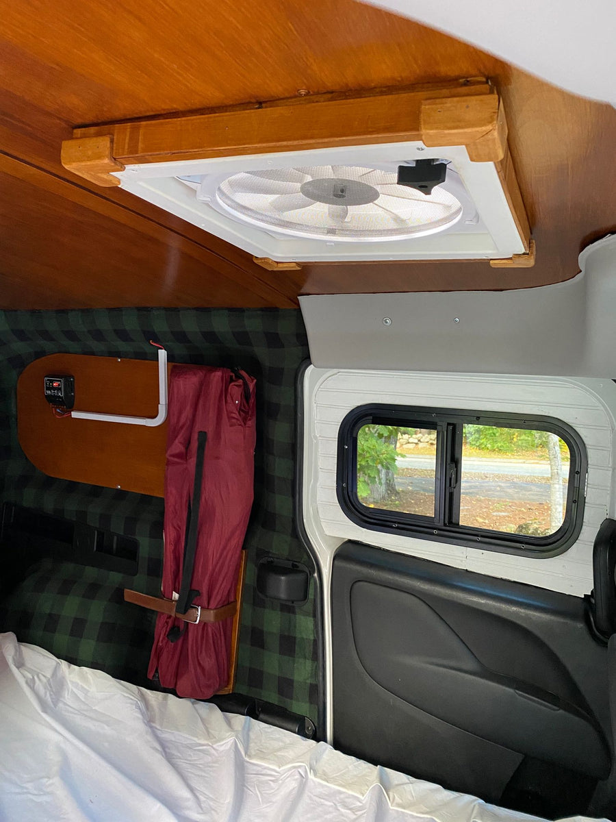 and a charcuterie board under warm lantern light.|White Maine Campervan Rentals van