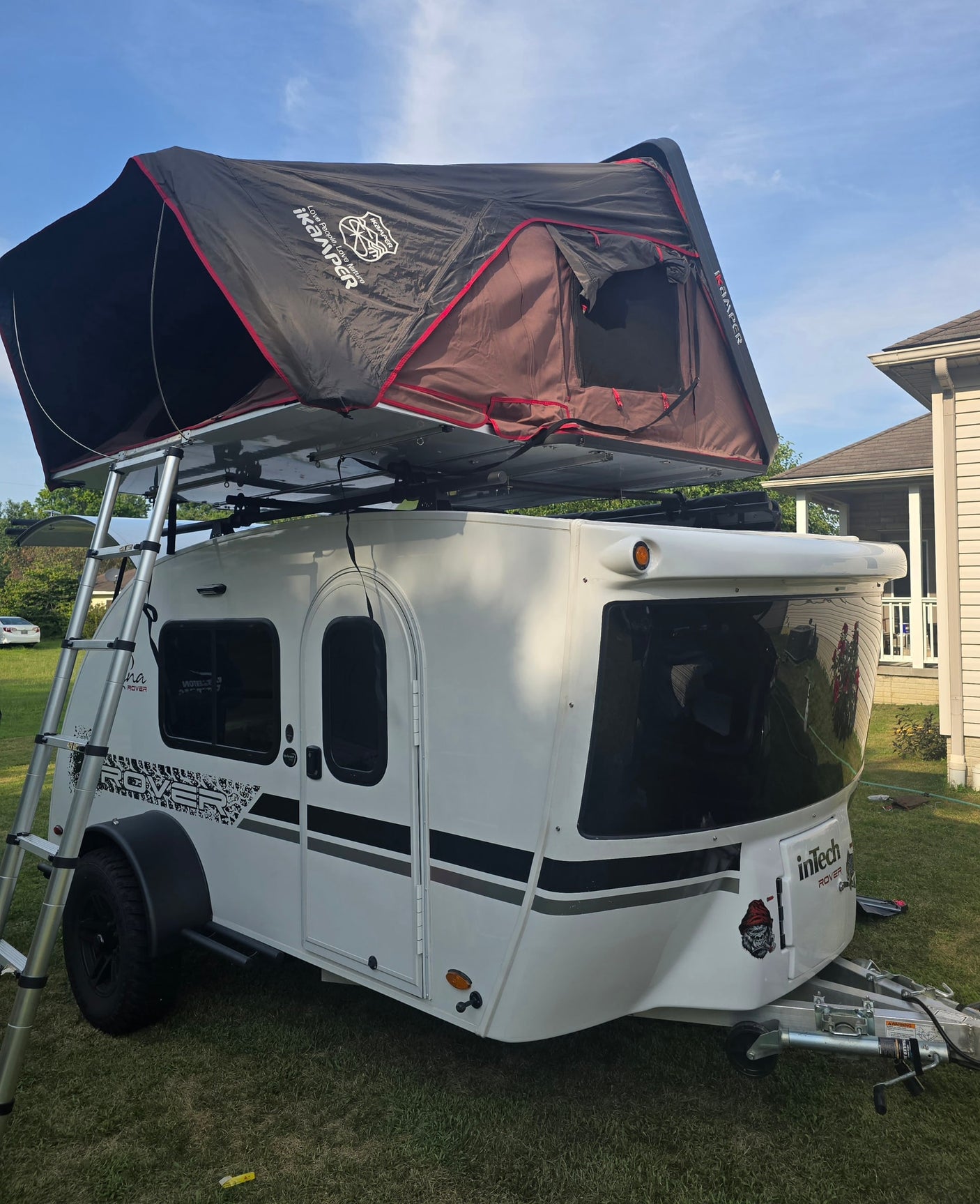 Teardrop RV rental: an InTech Rover trailer with an iKamper rooftop tent set up, complete with ladder, ready for adventure.