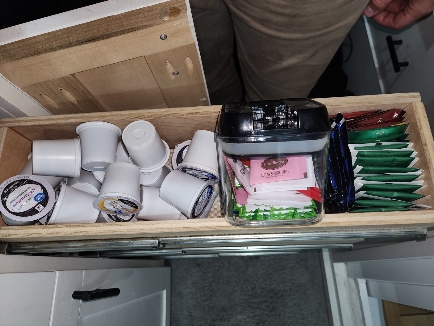 RV rental drawer stocked with K-cups, tea bags, and sweeteners for your coffee or tea needs during your trip.