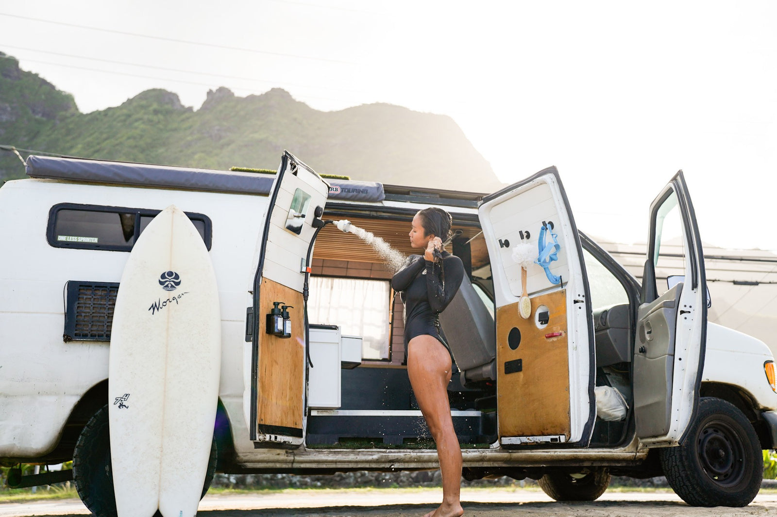 a surfboard nearby. Ideal for your next RV rental!|From an RV rental's deck: A sunny view of tropical homes