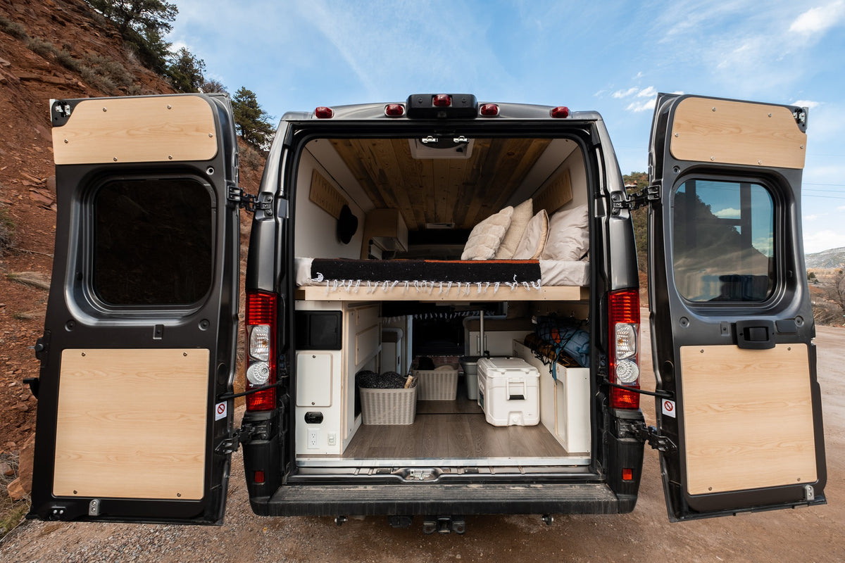 ready for your next outdoor adventure.|RV rental camper van with open back doors. Built-in bed — photo 2