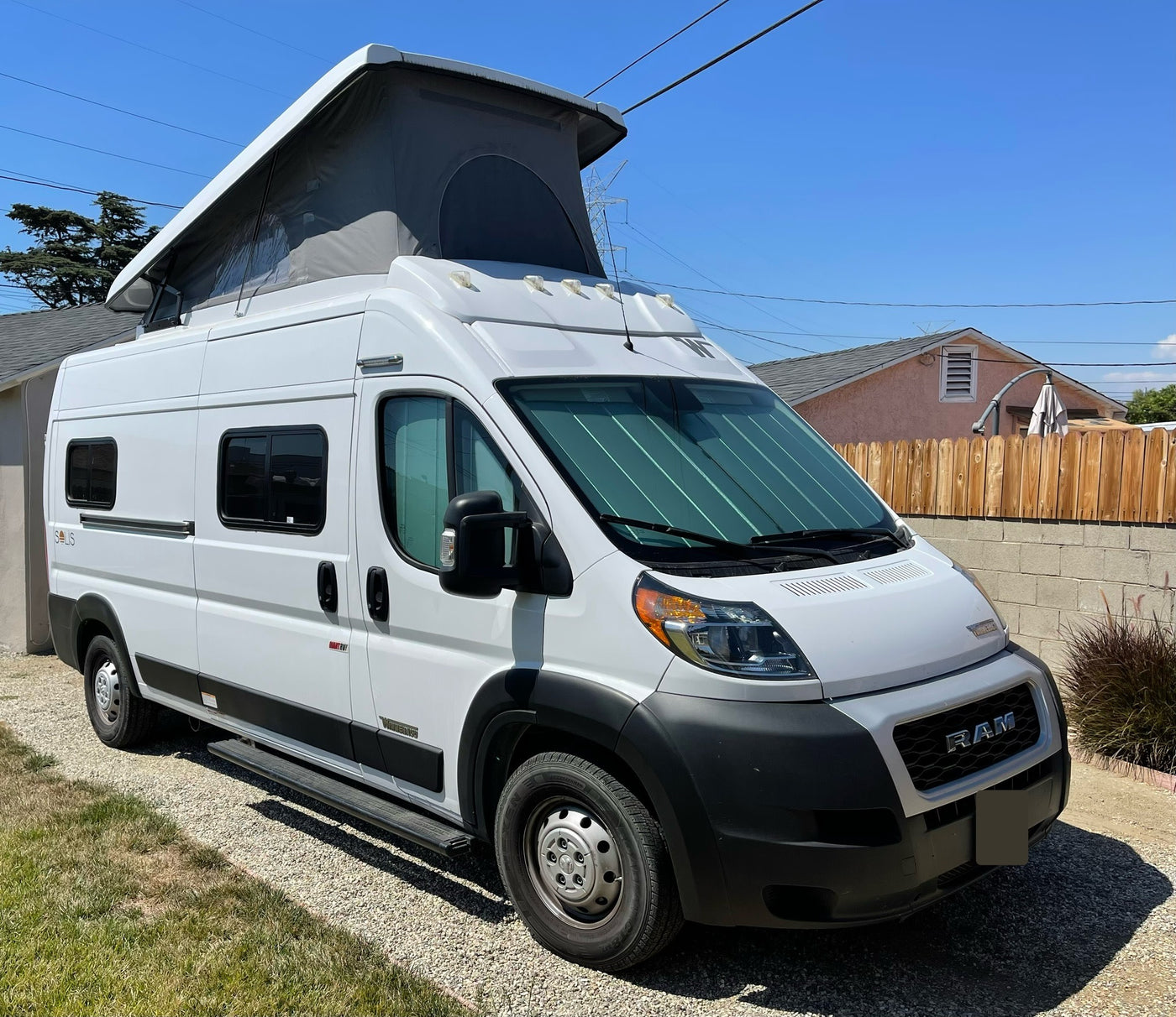 ready for adventure. Ideal for an rv rental.|White pop-top camper van — photo 11