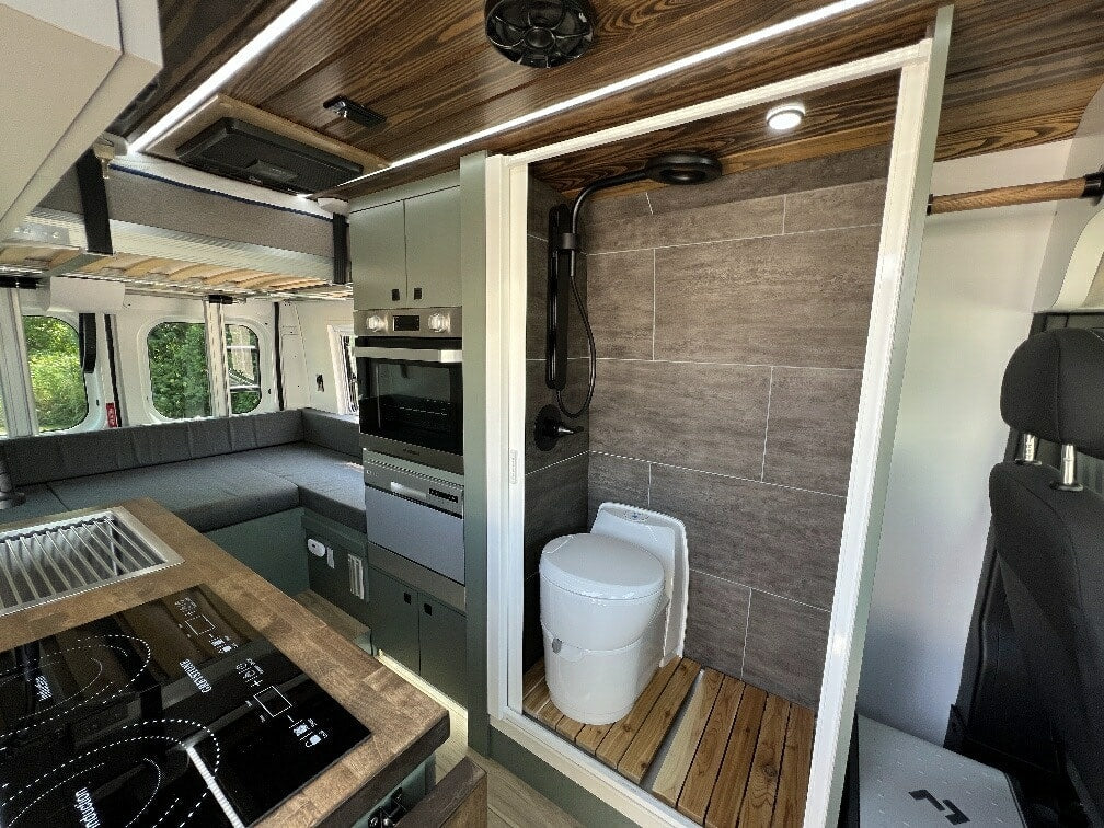 ready for pet adventures.|Custom white Ram ProMaster van for RV rental