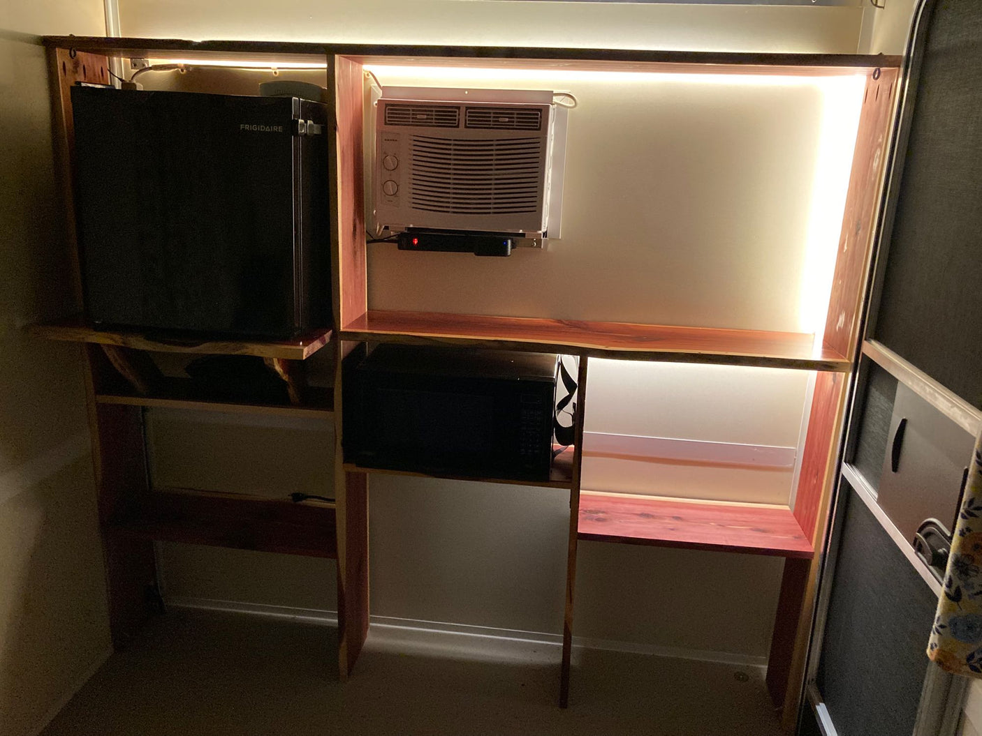 and AC unit provide a functional space.|A white compact Runaway Rouser RV rental teardrop camper