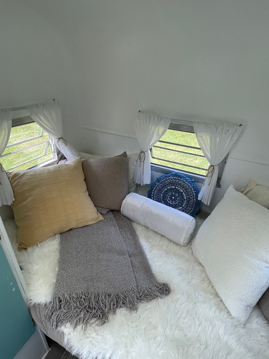 and a loft bed. Perfect for your next adventure!|Step inside this charming RV rental: a bright